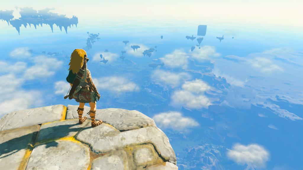 Visuel du jeu vidéo Zelda Tears Of The Kingdom. Link se tient debout au bord d'une falaise.